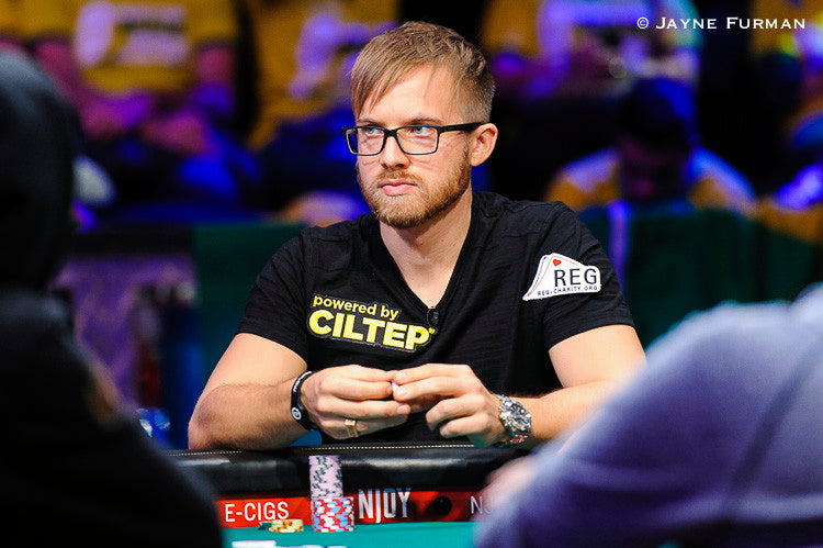 man sitting at poker table