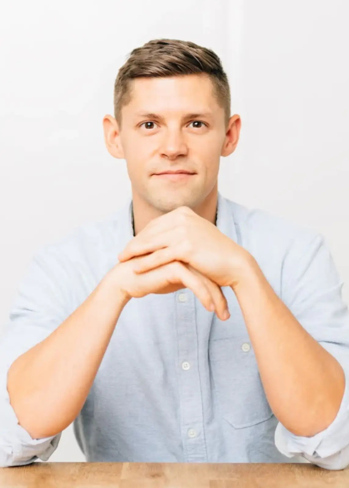 Man sitting with elbows on a table