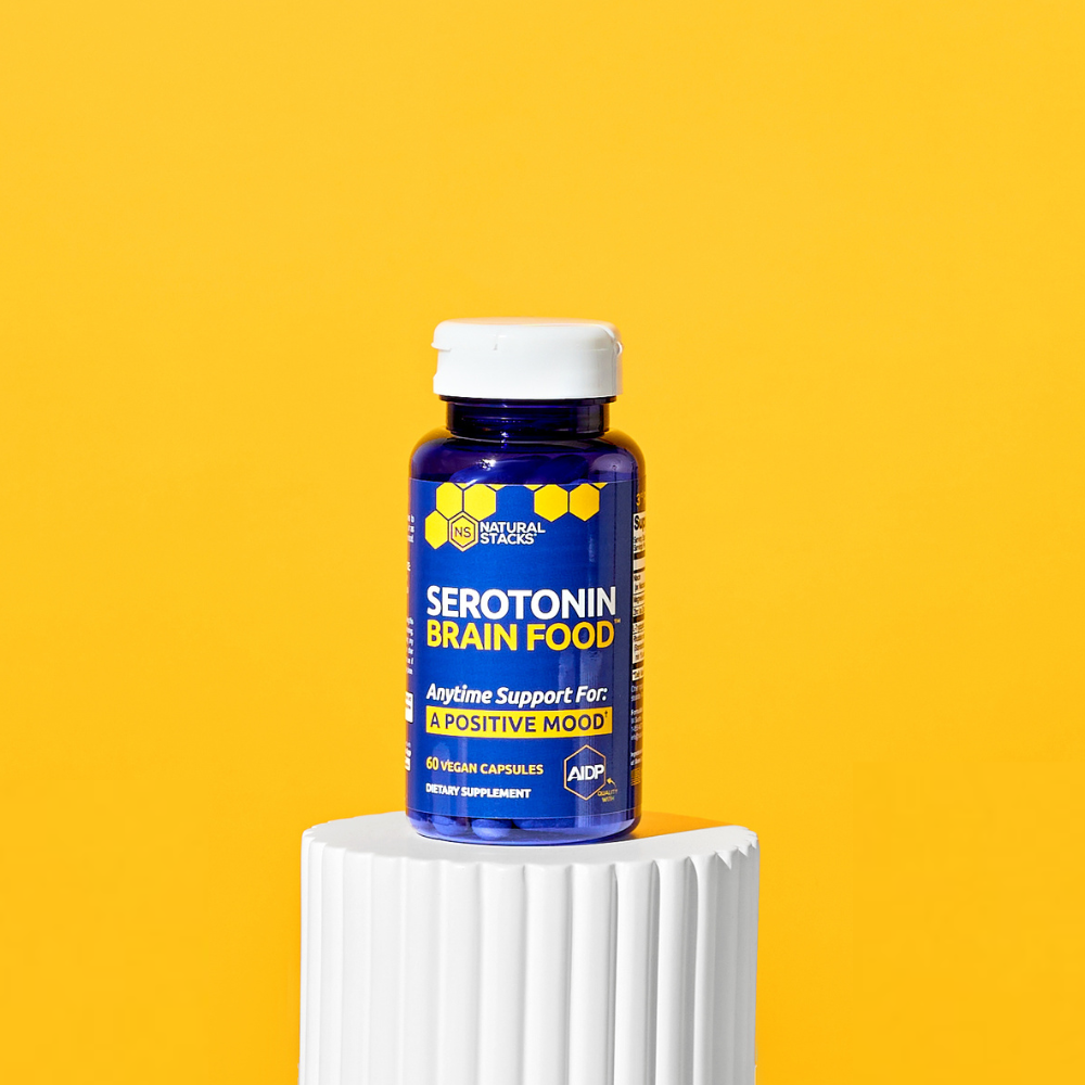 Bottle of 'Serotonin Brain Food' on a yellow background
