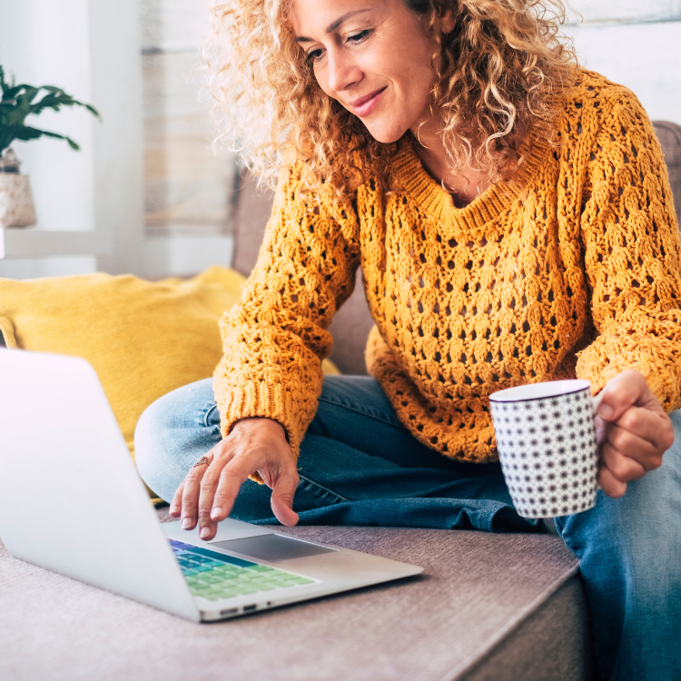 woman with a cup of coffee and computer