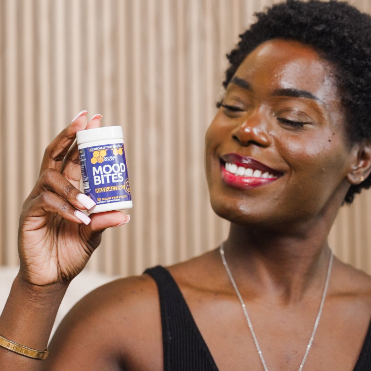 Woman smiling while holding mood bites