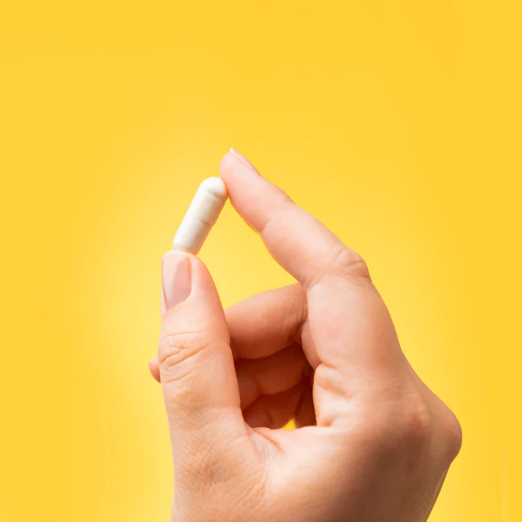 MagTech capsule held between fingers